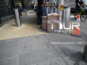 People are walking in Times Square where the machete stabbing is taking place. The New York City Police Department is saying that at approxi...