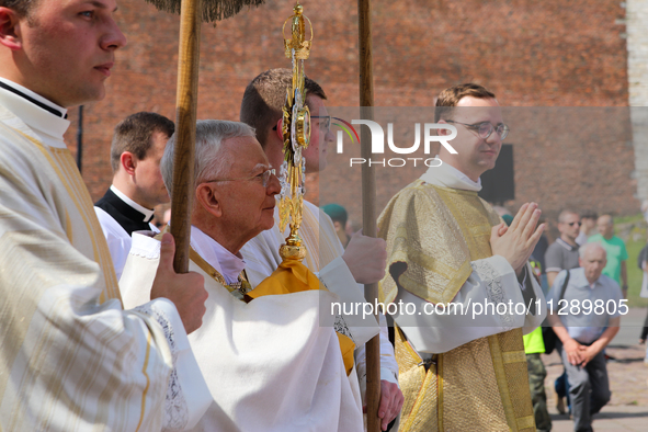 Metropolitan Archbishop of Krakow Marek Jedraszeski is walking through the city streets during the Corpus Christi procession in Krakow, Pola...