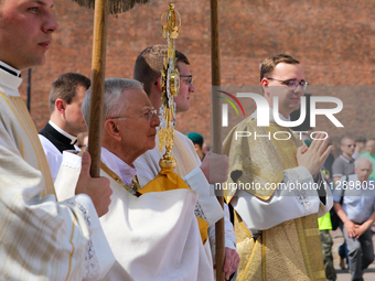 Metropolitan Archbishop of Krakow Marek Jedraszeski is walking through the city streets during the Corpus Christi procession in Krakow, Pola...