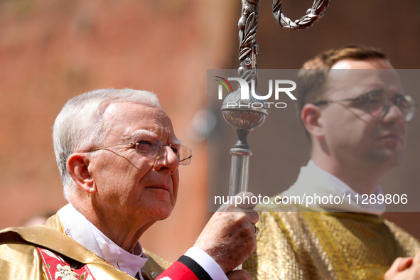 Metropolitan Archbishop of Krakow Marek Jedraszeski is walking through the city streets during the Corpus Christi procession in Krakow, Pola...