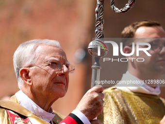 Metropolitan Archbishop of Krakow Marek Jedraszeski is walking through the city streets during the Corpus Christi procession in Krakow, Pola...