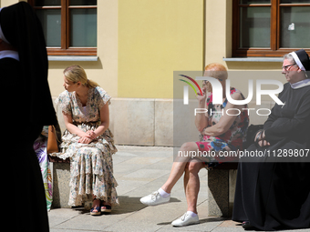 The Corpus Christi procession is walking through the city streets in Krakow, Poland, on May 30, 2024. The Solemnity of the Most Holy Body an...