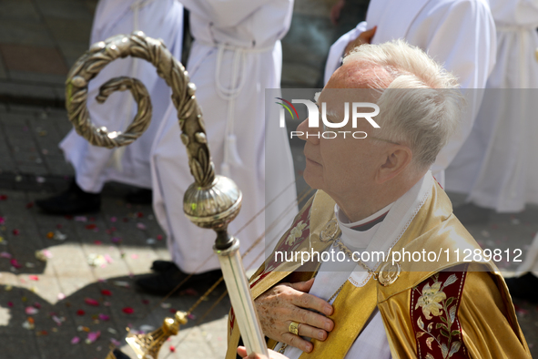 Metropolitan Archbishop of Krakow Marek Jedraszeski is walking through the city streets during the Corpus Christi procession in Krakow, Pola...