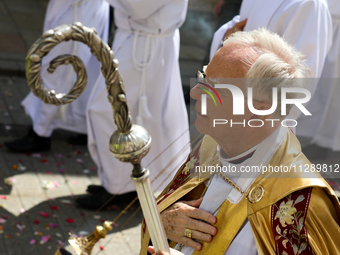 Metropolitan Archbishop of Krakow Marek Jedraszeski is walking through the city streets during the Corpus Christi procession in Krakow, Pola...