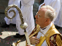 Metropolitan Archbishop of Krakow Marek Jedraszeski is walking through the city streets during the Corpus Christi procession in Krakow, Pola...