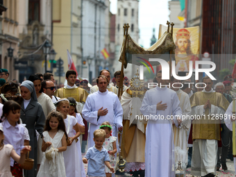 The Corpus Christi procession is walking through the city streets in Krakow, Poland, on May 30, 2024. The Solemnity of the Most Holy Body an...