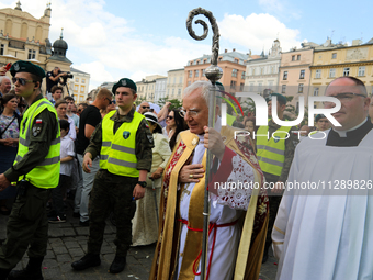 Metropolitan Archbishop of Krakow Marek Jedraszeski is walking through the city streets during the Corpus Christi procession in Krakow, Pola...