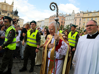 Metropolitan Archbishop of Krakow Marek Jedraszeski is walking through the city streets during the Corpus Christi procession in Krakow, Pola...