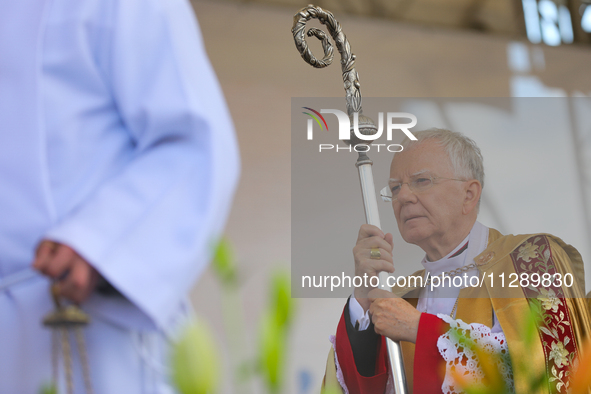 Metropolitan Archbishop of Krakow Marek Jedraszeski is walking through the city streets during the Corpus Christi procession in Krakow, Pola...