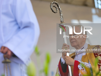 Metropolitan Archbishop of Krakow Marek Jedraszeski is walking through the city streets during the Corpus Christi procession in Krakow, Pola...