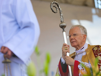 Metropolitan Archbishop of Krakow Marek Jedraszeski is walking through the city streets during the Corpus Christi procession in Krakow, Pola...