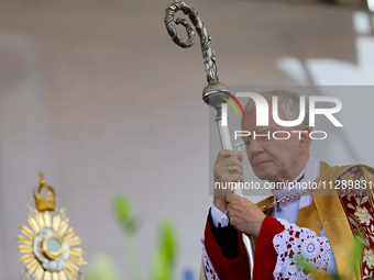 Metropolitan Archbishop of Krakow Marek Jedraszeski is walking through the city streets during the Corpus Christi procession in Krakow, Pola...