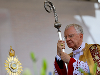 Metropolitan Archbishop of Krakow Marek Jedraszeski is walking through the city streets during the Corpus Christi procession in Krakow, Pola...