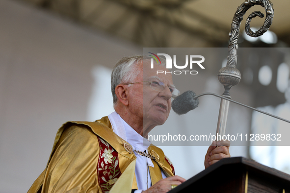 Metropolitan Archbishop of Krakow Marek Jedraszeski is walking through the city streets during the Corpus Christi procession in Krakow, Pola...