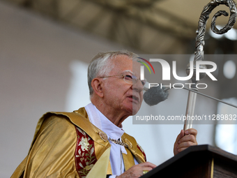 Metropolitan Archbishop of Krakow Marek Jedraszeski is walking through the city streets during the Corpus Christi procession in Krakow, Pola...