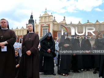 The Corpus Christi procession is walking through the city streets in Krakow, Poland, on May 30, 2024. The Solemnity of the Most Holy Body an...