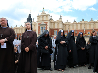 The Corpus Christi procession is walking through the city streets in Krakow, Poland, on May 30, 2024. The Solemnity of the Most Holy Body an...