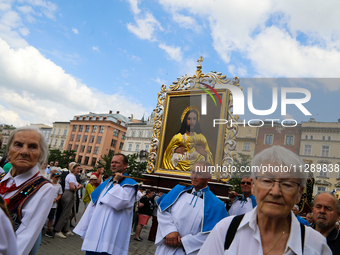 The Corpus Christi procession is walking through the city streets in Krakow, Poland, on May 30, 2024. The Solemnity of the Most Holy Body an...