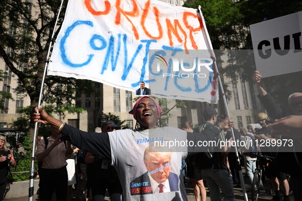 People are rejoicing across the street from Manhattan Criminal Court in New York, United States, on May 30, 2024, moments after a jury finds...