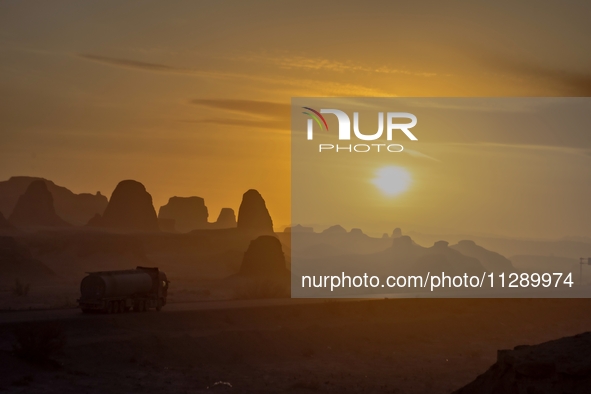 The Yadan landform landscape of the Devil City scenic area in the desert Gobi is being seen at sunset after strong winds in Karamay, China,...