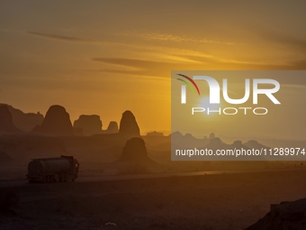 The Yadan landform landscape of the Devil City scenic area in the desert Gobi is being seen at sunset after strong winds in Karamay, China,...