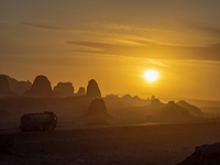 The Yadan landform landscape of the Devil City scenic area in the desert Gobi is being seen at sunset after strong winds in Karamay, China,...