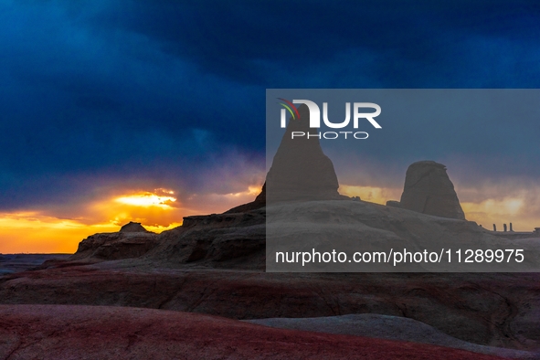 The Yadan landform landscape of the Devil City scenic area in the desert Gobi is being seen at sunset after strong winds in Karamay, China,...