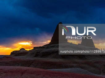 The Yadan landform landscape of the Devil City scenic area in the desert Gobi is being seen at sunset after strong winds in Karamay, China,...