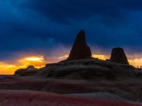 The Yadan landform landscape of the Devil City scenic area in the desert Gobi is being seen at sunset after strong winds in Karamay, China,...