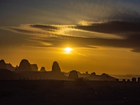 The Yadan landform landscape of the Devil City scenic area in the desert Gobi is being seen at sunset after strong winds in Karamay, China,...