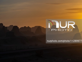 The Yadan landform landscape of the Devil City scenic area in the desert Gobi is being seen at sunset after strong winds in Karamay, China,...