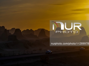 The Yadan landform landscape of the Devil City scenic area in the desert Gobi is being seen at sunset after strong winds in Karamay, China,...