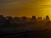 The Yadan landform landscape of the Devil City scenic area in the desert Gobi is being seen at sunset after strong winds in Karamay, China,...