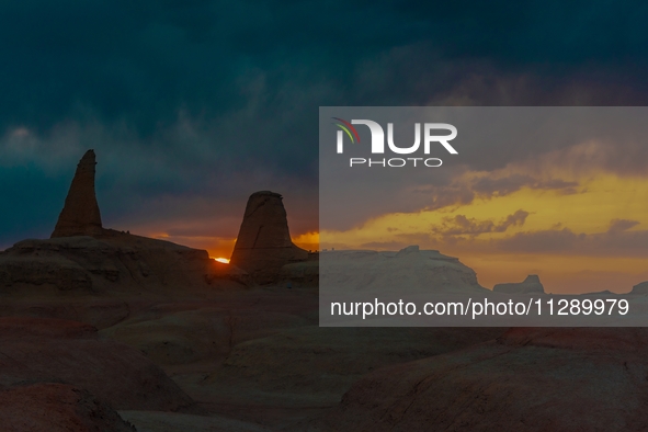 The Yadan landform landscape of the Devil City scenic area in the desert Gobi is being seen at sunset after strong winds in Karamay, China,...