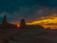 The Yadan landform landscape of the Devil City scenic area in the desert Gobi is being seen at sunset after strong winds in Karamay, China,...