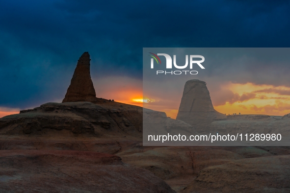 The Yadan landform landscape of the Devil City scenic area in the desert Gobi is being seen at sunset after strong winds in Karamay, China,...