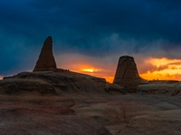 The Yadan landform landscape of the Devil City scenic area in the desert Gobi is being seen at sunset after strong winds in Karamay, China,...