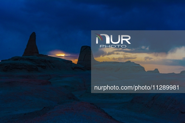 The Yadan landform landscape of the Devil City scenic area in the desert Gobi is being seen at sunset after strong winds in Karamay, China,...