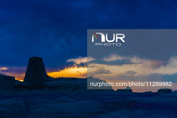 The Yadan landform landscape of the Devil City scenic area in the desert Gobi is being seen at sunset after strong winds in Karamay, China,...