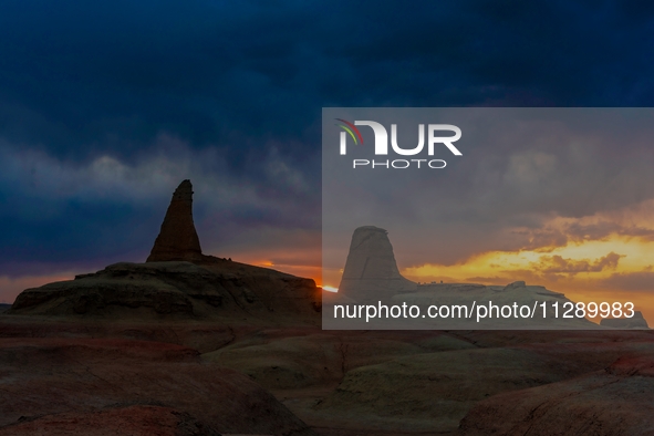 The Yadan landform landscape of the Devil City scenic area in the desert Gobi is being seen at sunset after strong winds in Karamay, China,...