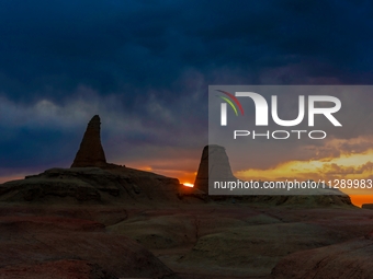 The Yadan landform landscape of the Devil City scenic area in the desert Gobi is being seen at sunset after strong winds in Karamay, China,...