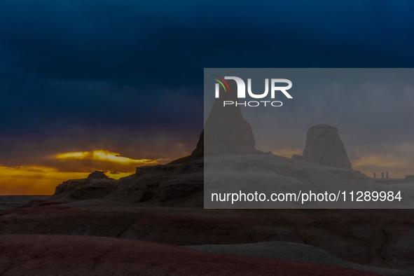 The Yadan landform landscape of the Devil City scenic area in the desert Gobi is being seen at sunset after strong winds in Karamay, China,...