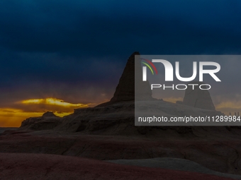 The Yadan landform landscape of the Devil City scenic area in the desert Gobi is being seen at sunset after strong winds in Karamay, China,...