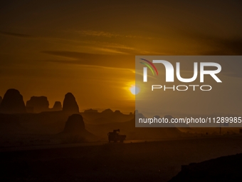 The Yadan landform landscape of the Devil City scenic area in the desert Gobi is being seen at sunset after strong winds in Karamay, China,...