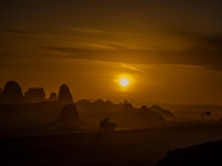 The Yadan landform landscape of the Devil City scenic area in the desert Gobi is being seen at sunset after strong winds in Karamay, China,...