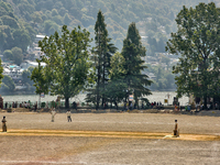 Men are playing a game of cricket in Nainital, Uttarakhand, India, on April 21, 2024. (