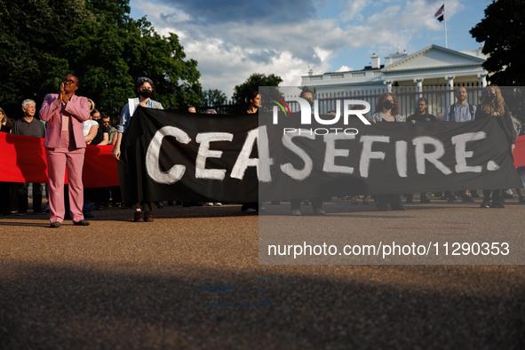 People attend a 'Mourner's Kaddish for Rafah' demonstration in front of the White House in Washington, D.C. on May 30, 2024. The action was...