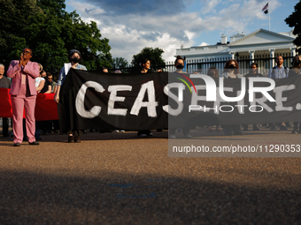 People attend a 'Mourner's Kaddish for Rafah' demonstration in front of the White House in Washington, D.C. on May 30, 2024. The action was...