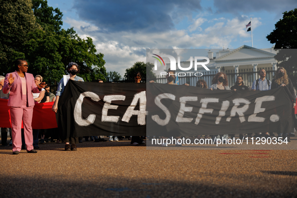 People attend a 'Mourner's Kaddish for Rafah' demonstration in front of the White House in Washington, D.C. on May 30, 2024. The action was...