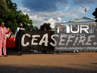 People attend a 'Mourner's Kaddish for Rafah' demonstration in front of the White House in Washington, D.C. on May 30, 2024. The action was...